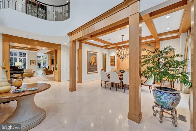 a dining room with furniture and a chandelier