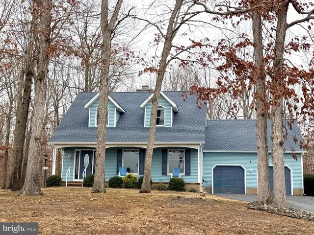 a front view of a house with yard