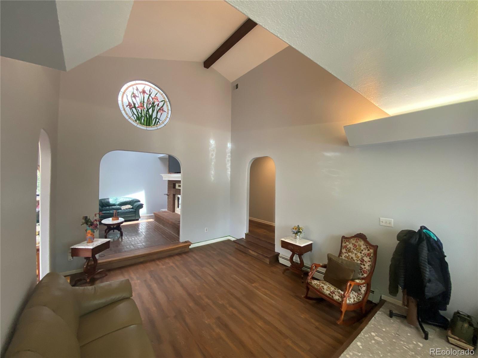 7079 Estes Drive Arvada, CO 80004 - Photo 11 of 50 a view of a workspace with furniture and a window