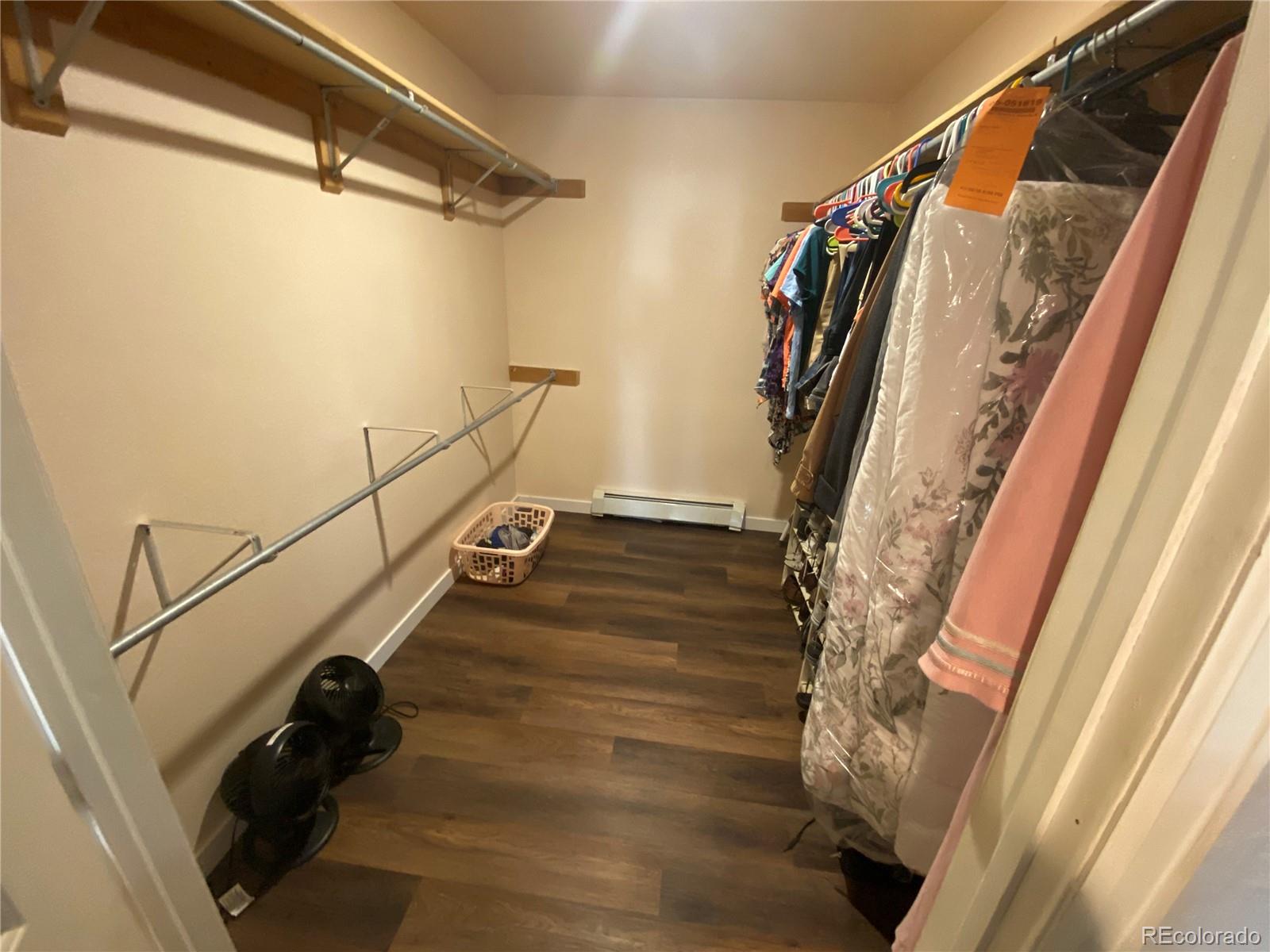 7079 Estes Drive Arvada, CO 80004 - Photo 23 of 50 a view of walk in entryway with wooden floor