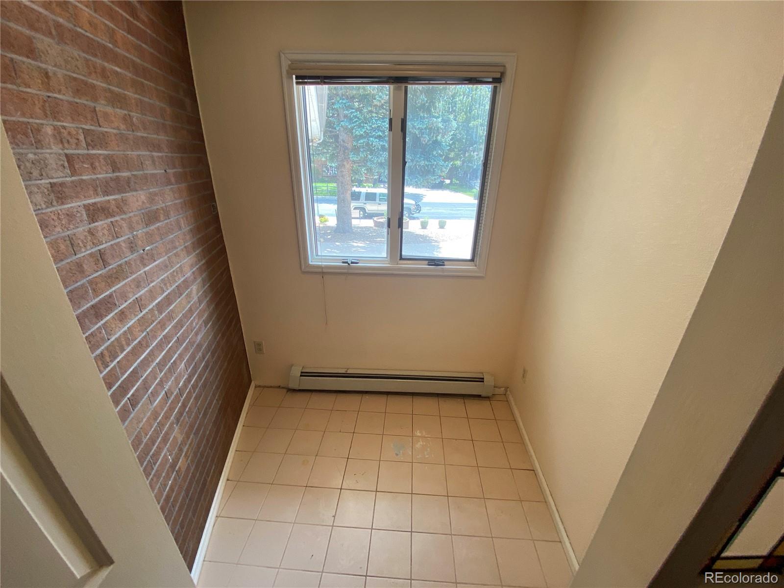 7079 Estes Drive Arvada, CO 80004 - Photo 29 of 50 a view of an empty room with a window