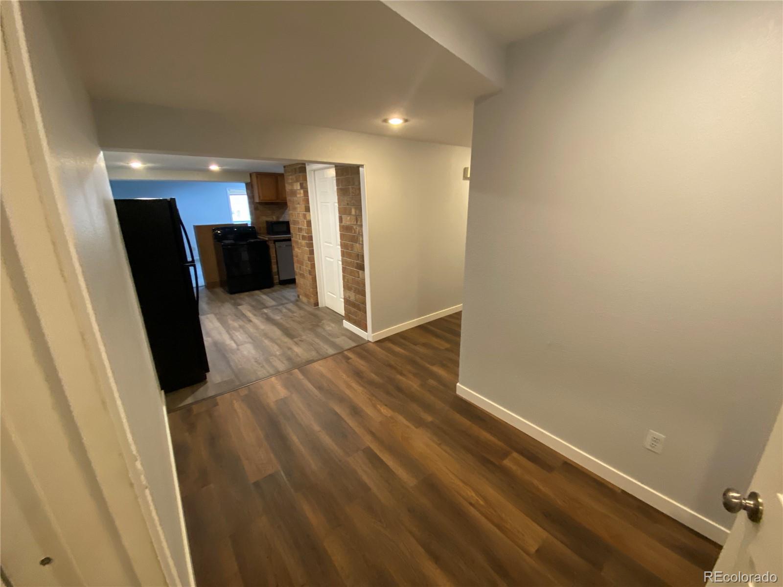 7079 Estes Drive Arvada, CO 80004 - Photo 32 of 50 a view of entryway with kitchen