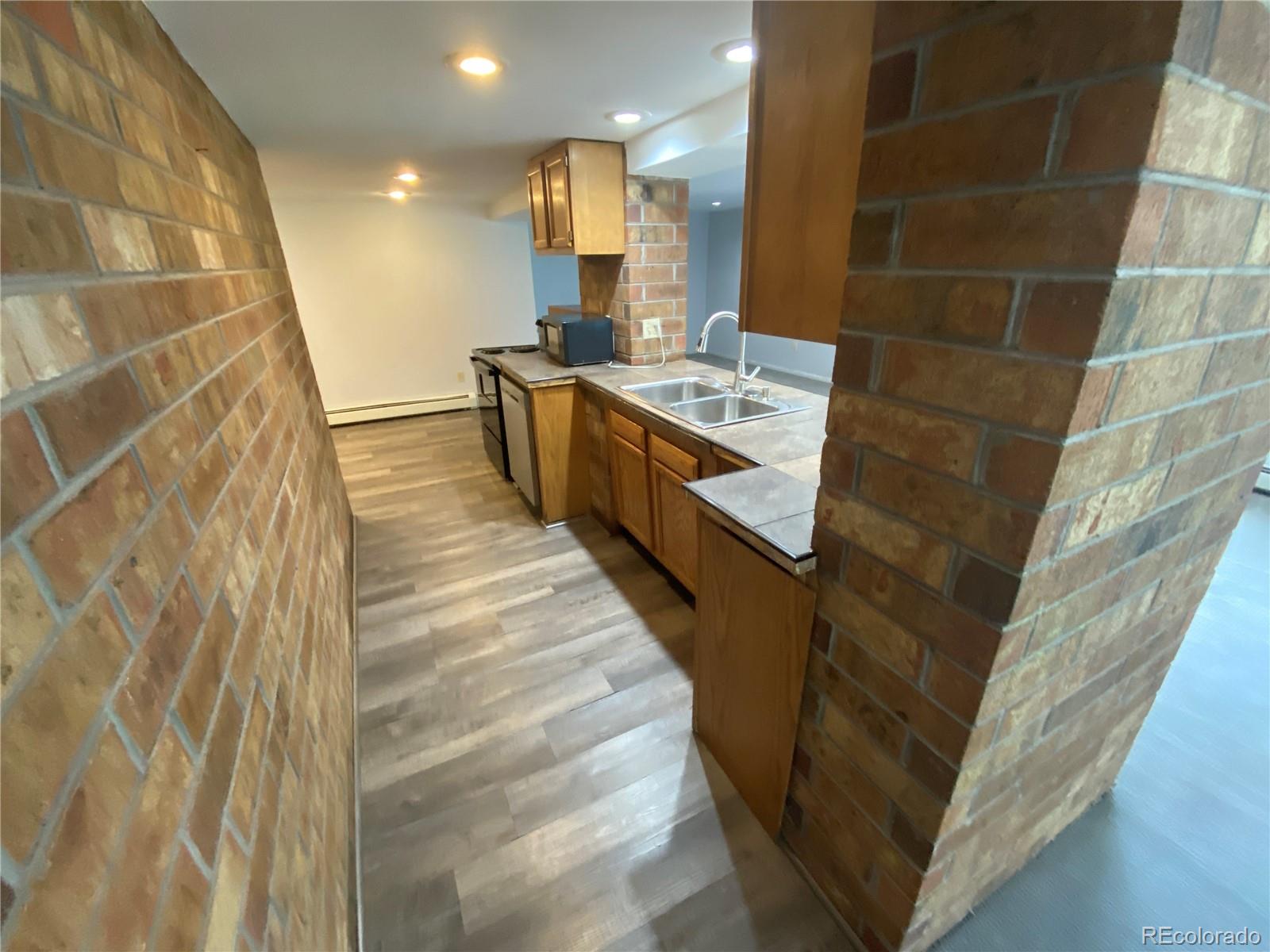 7079 Estes Drive Arvada, CO 80004 - Photo 34 of 50 a bathroom with a sink and a mirror
