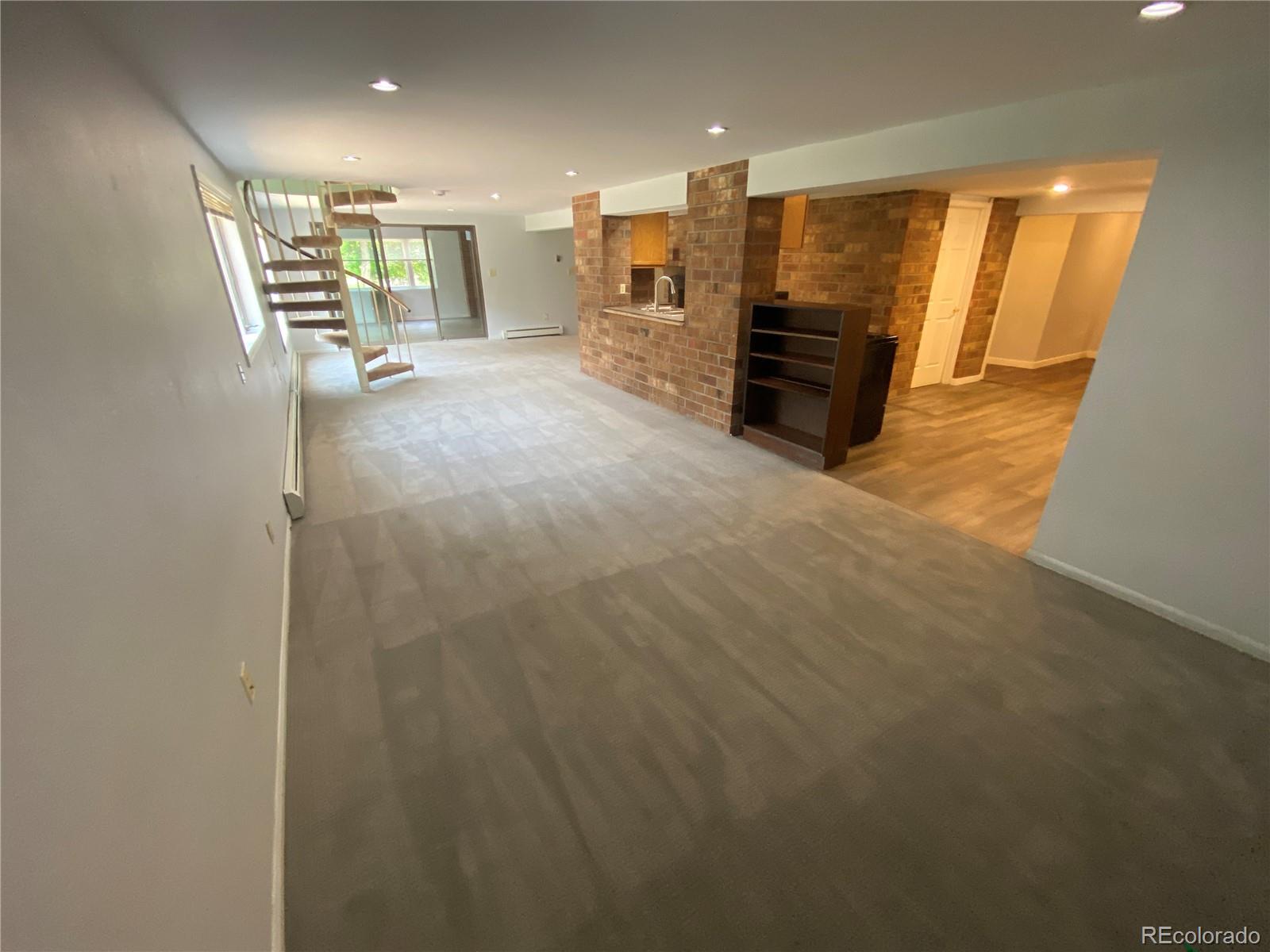 7079 Estes Drive Arvada, CO 80004 - Photo 35 of 50 a view of a hallway with seating area