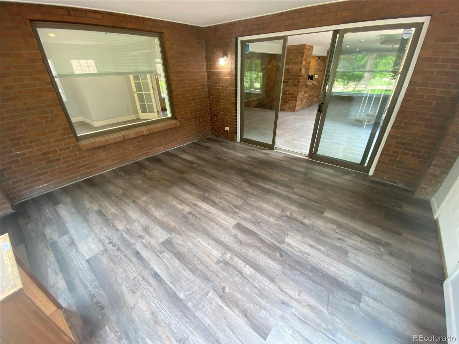 7079 Estes Drive Arvada, CO 80004 - Photo 38 of 50 a view of an empty room with glass door