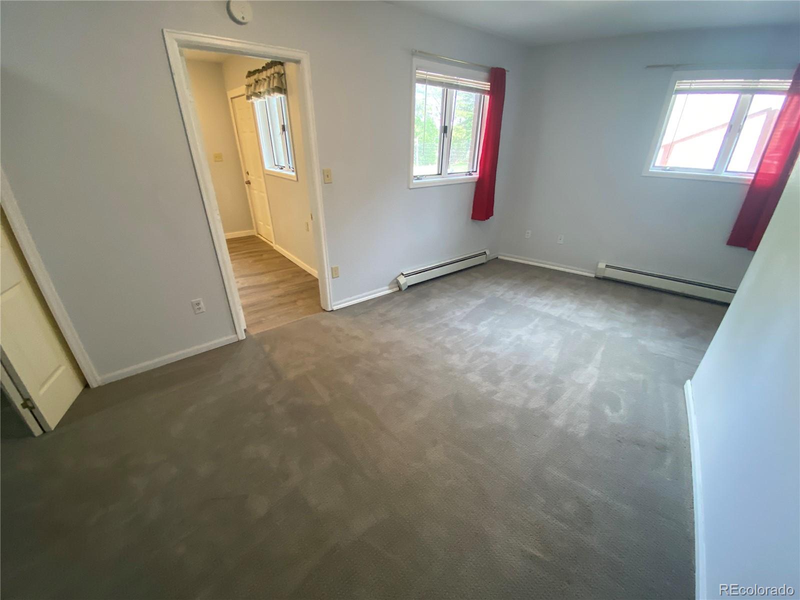 7079 Estes Drive Arvada, CO 80004 - Photo 45 of 50 an empty room with windows