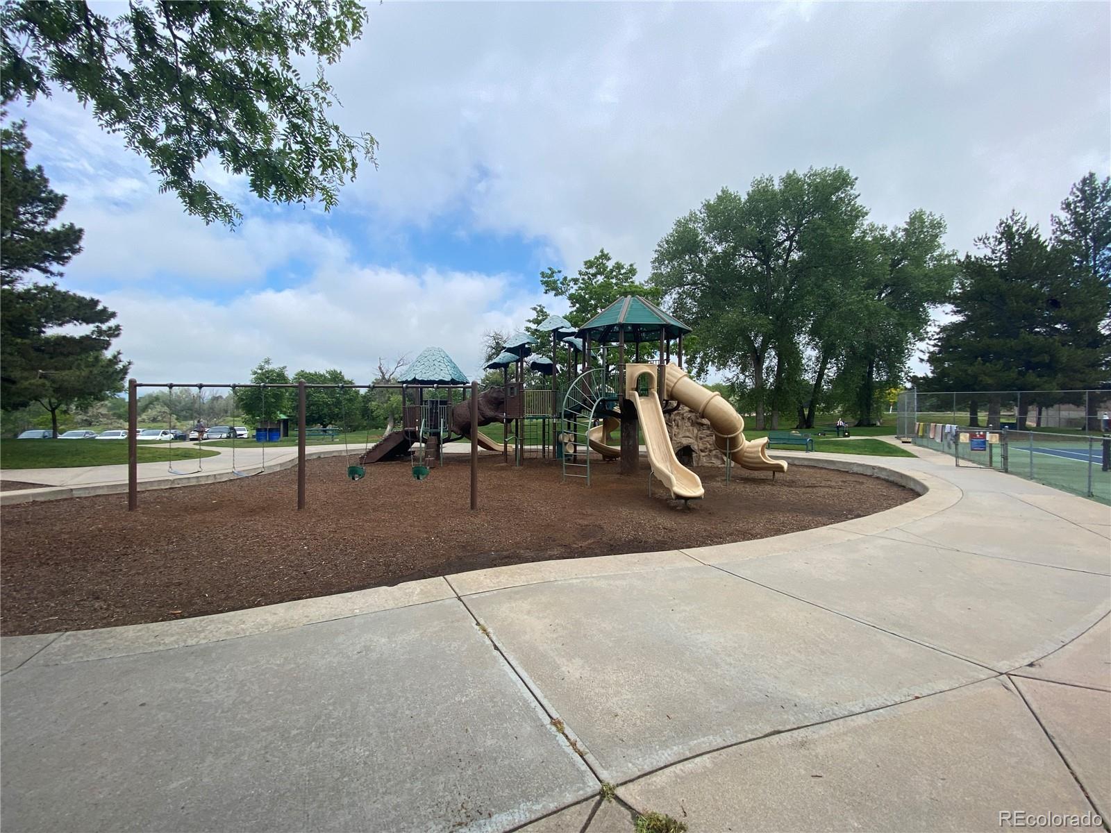 7079 Estes Drive Arvada, CO 80004 - Photo 48 of 50 a park with lots of swings and slides
