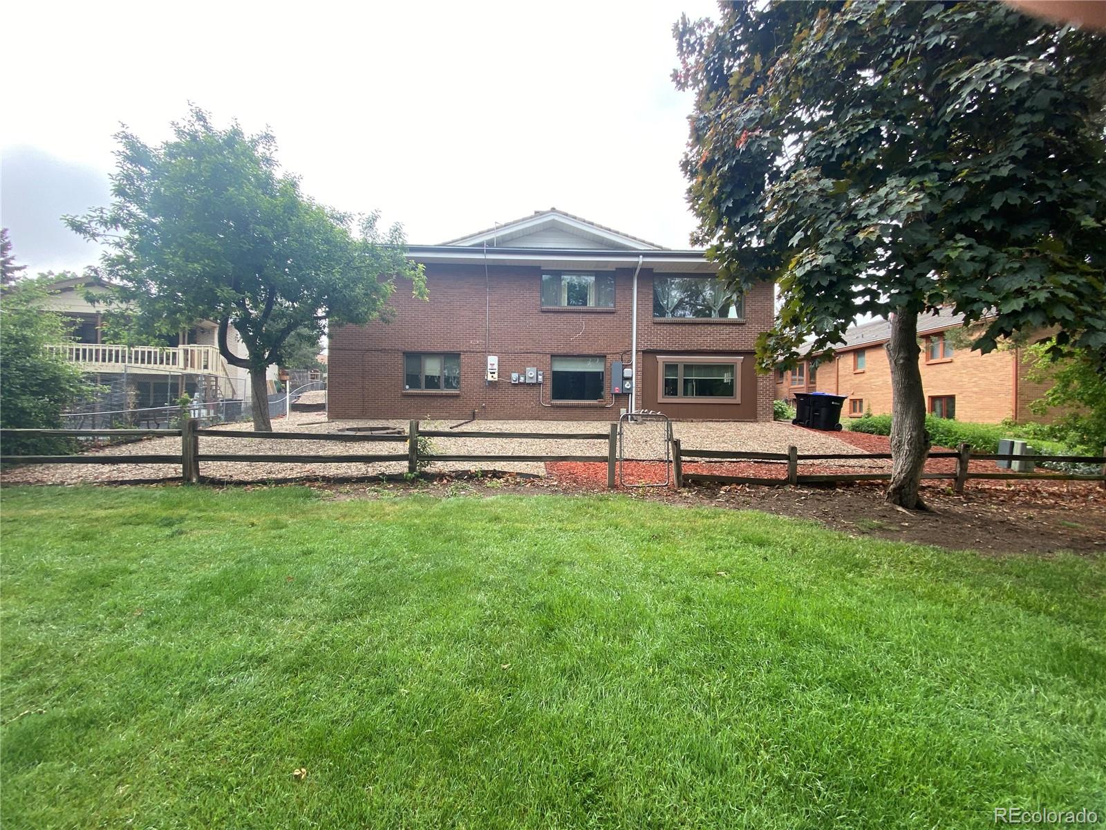 7079 Estes Drive Arvada, CO 80004 - Photo 8 of 50 a view of a house with backyard and a tree