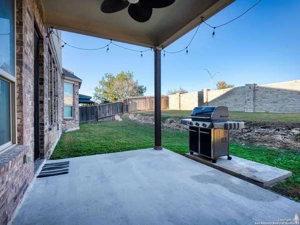 a view of a house with backyard and porch