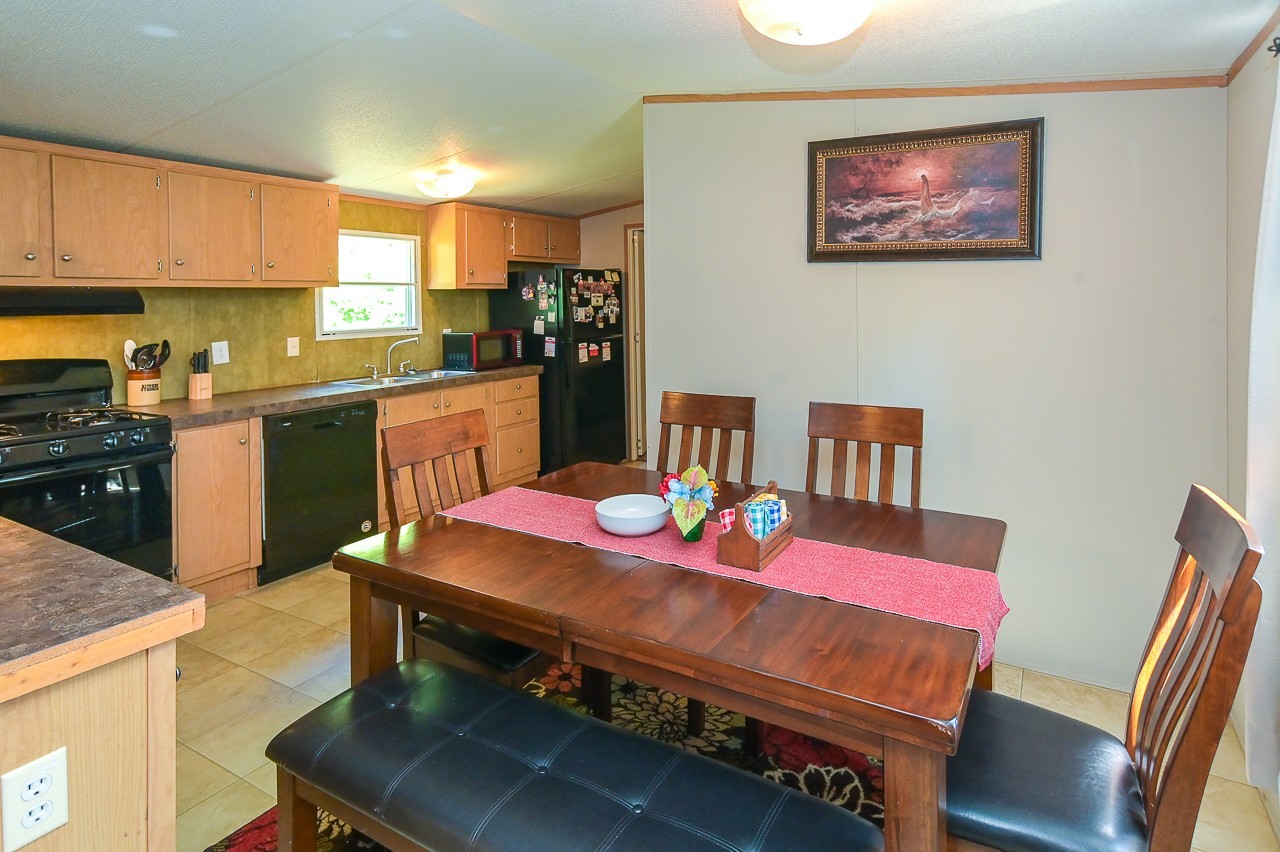 41 Sweet Springs Road Kelso, TN 37348 - Photo 12 of 38 a kitchen with a dining table chairs and kitchen view