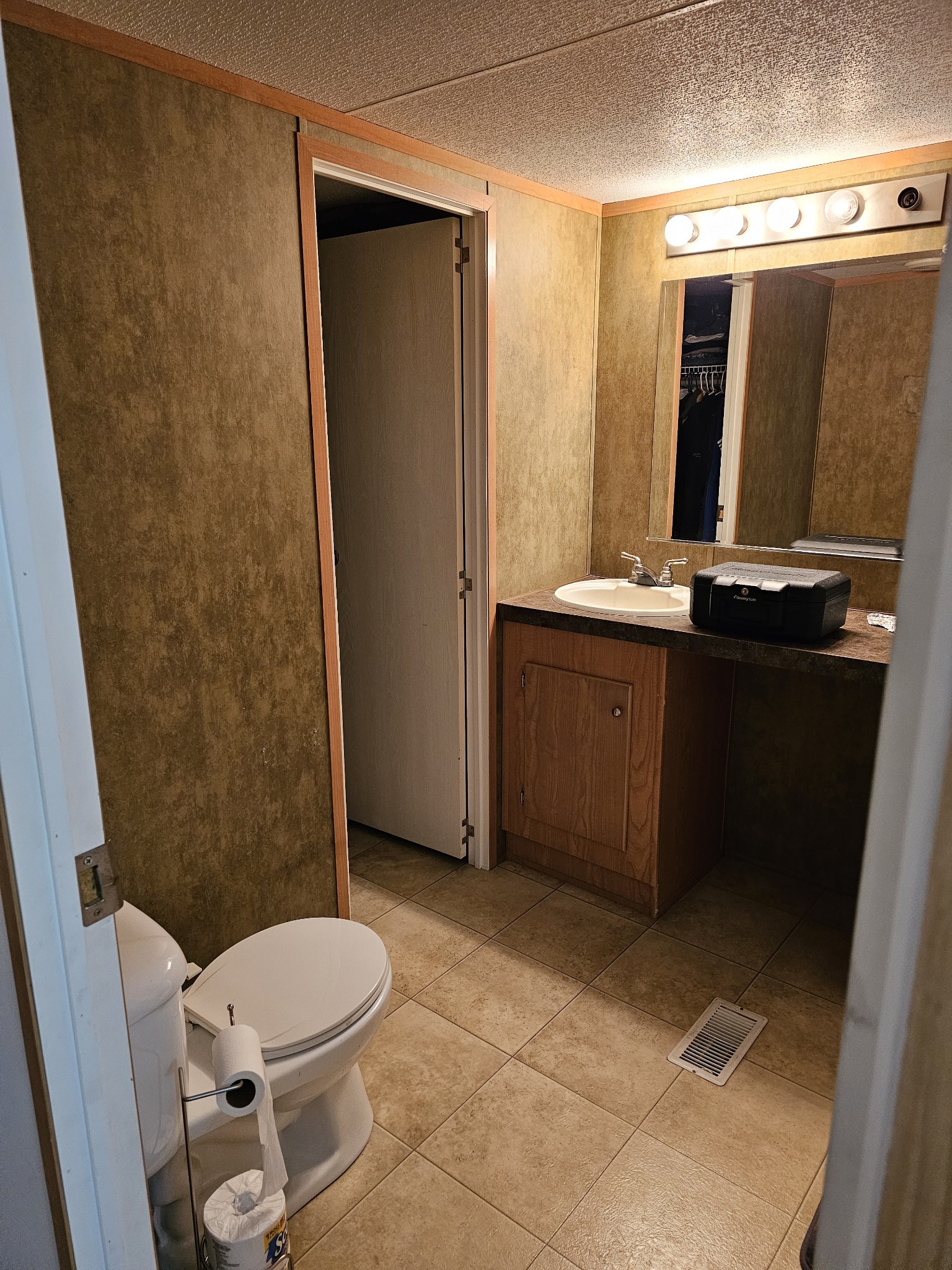 41 Sweet Springs Road Kelso, TN 37348 - Photo 19 of 38 a bathroom with a sink a toilet a mirror and shower
