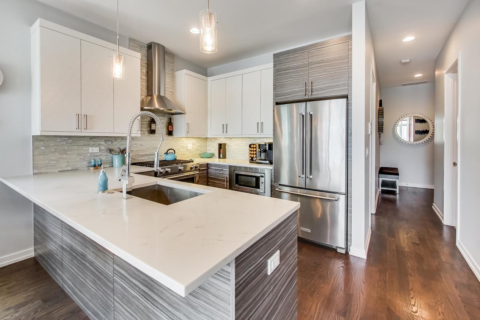 1033 South Racine Avenue, Unit 3SR Chicago, IL 60607 - Photo 11 of 49 a kitchen with a refrigerator a sink and wooden floor