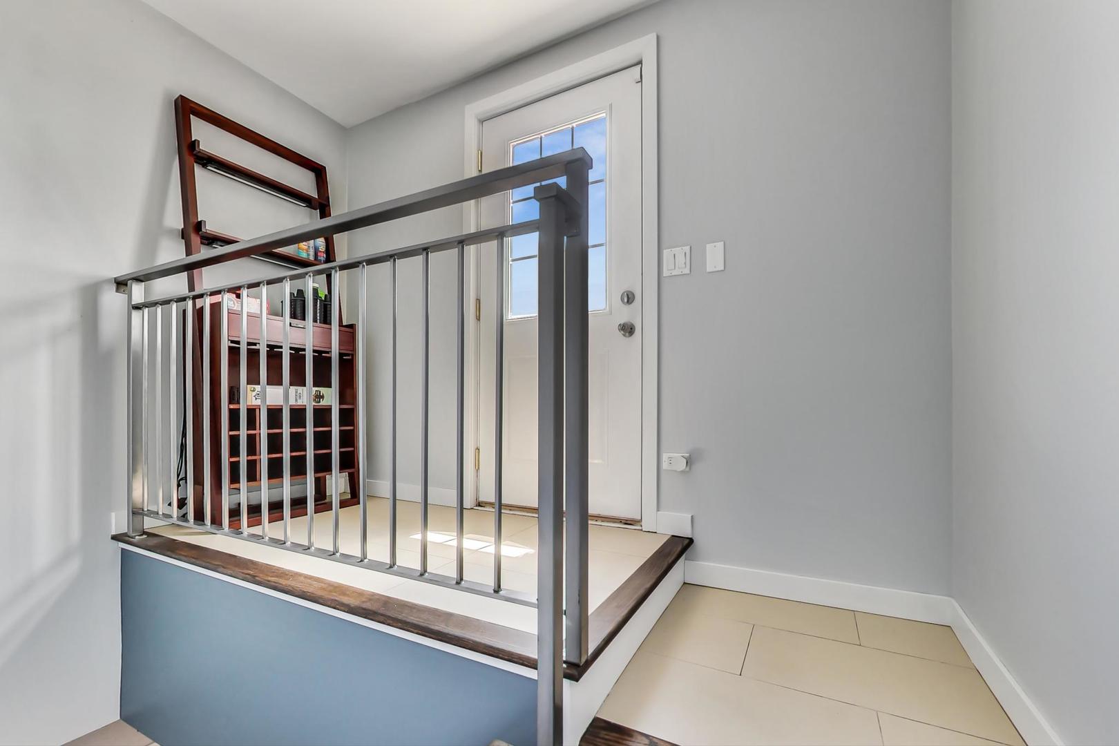 1033 South Racine Avenue, Unit 3SR Chicago, IL 60607 - Photo 36 of 49 a view of staircase and bathroom with wooden floor