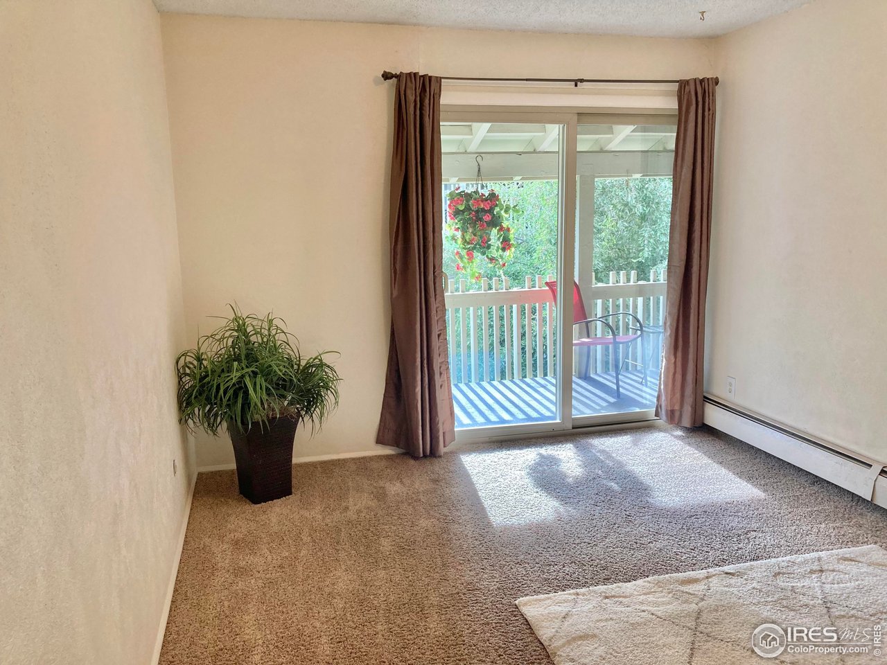 2707 Valmont Road, Unit 303C Boulder, CO 80304 - Photo 13 of 20 Primary Bedroom with sliding glass door to the balcony