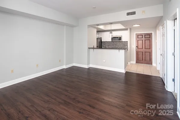 a view of kitchen with wooden floor