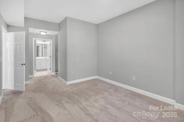 a view of an empty room and closet