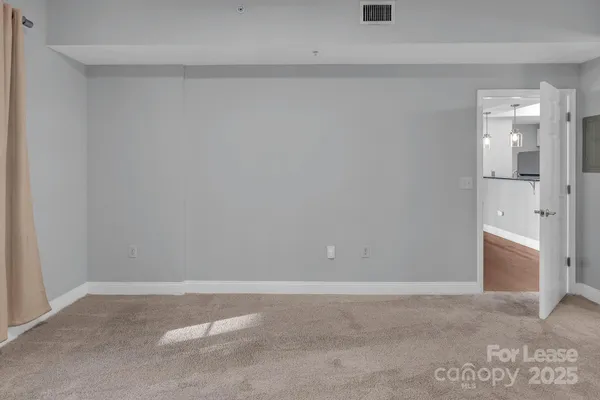 a front view of a building with a garden