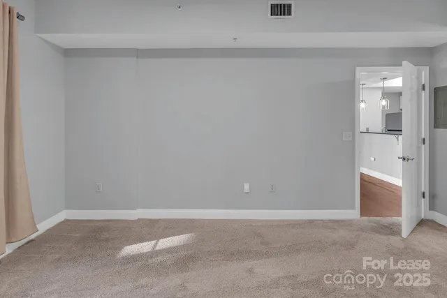 a front view of a building with a garden