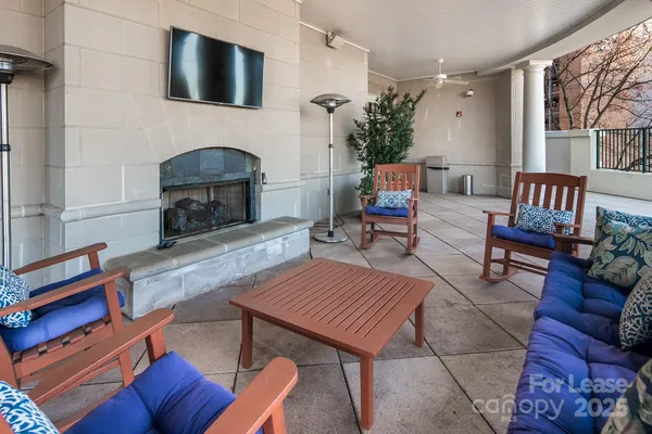 a dining room with furniture and garden view