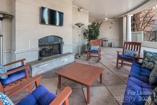 a dining room with furniture and garden view