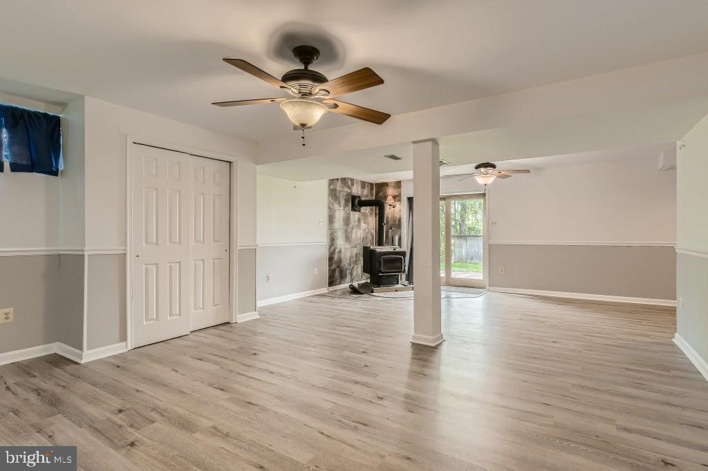 16712 Ridge Road Upperco, MD 21155 - Photo 26 of 33 fully finished lower level with wood burning stove