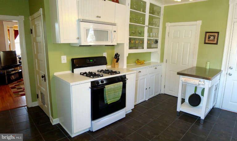5504 Tramore Road Baltimore, MD 21214 - Photo 8 of 29 a kitchen with a stove and a microwave