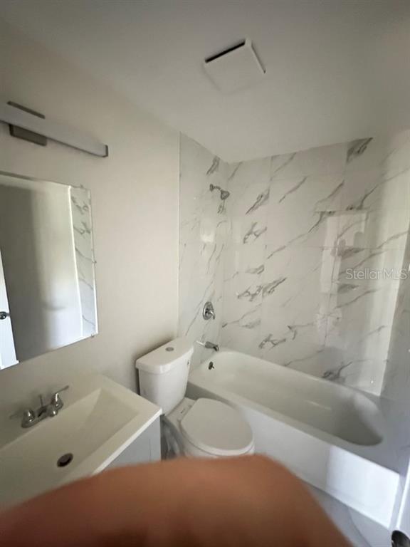 534 Charles Court Orlando, FL 32805 - Photo 7 of 8 a bathroom with a bathtub and a shower