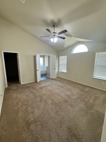 a view of an empty room with a window