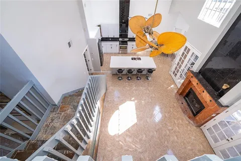an aerial view of a fireplace with wooden floor