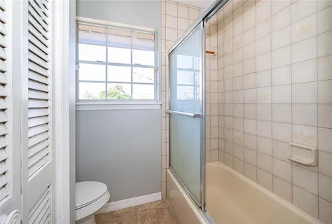 a bathroom with a bathtub and toilet