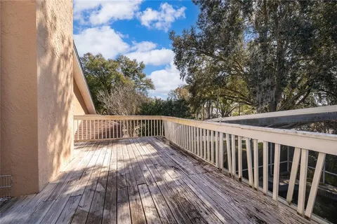 a view of balcony with wooden floor