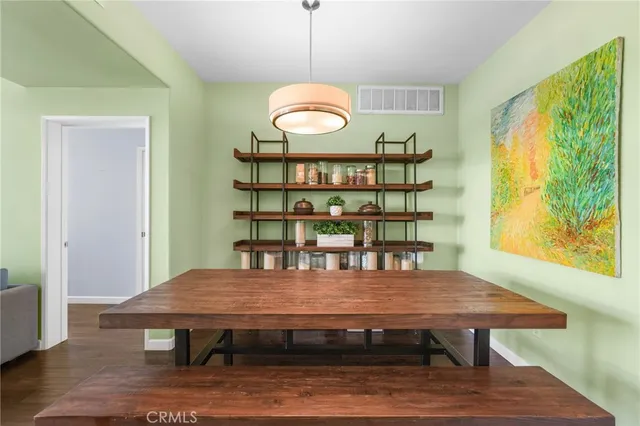 a bedroom with a large bed and a tv on table