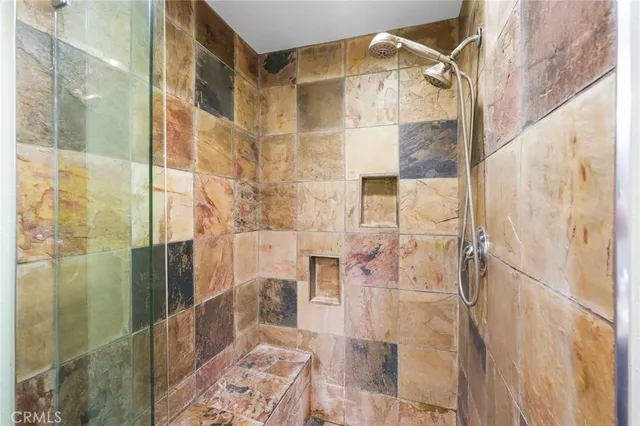 a bathroom with a glass shower door