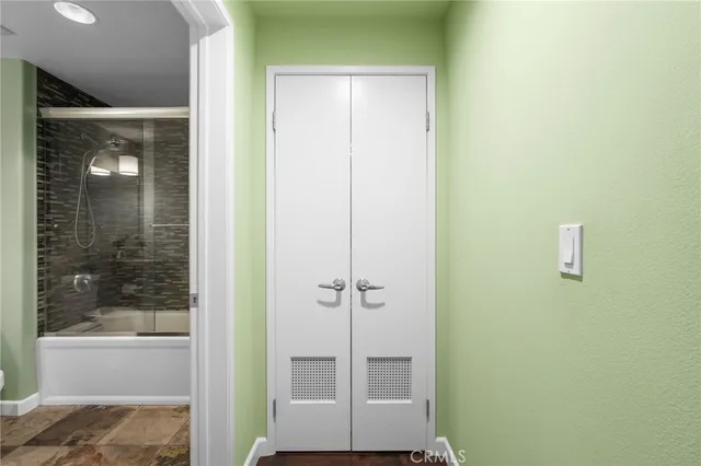 a view of a hallway with washer and dryer