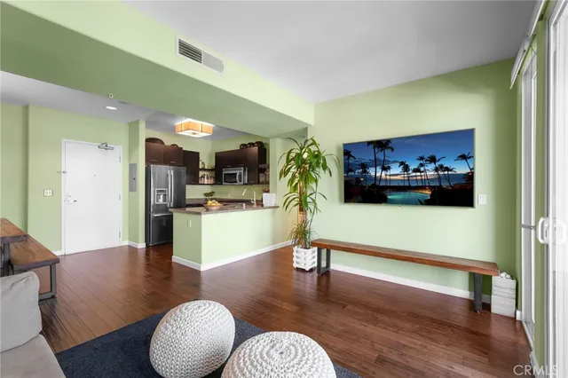 a kitchen with stainless steel appliances granite countertop a refrigerator and a stove