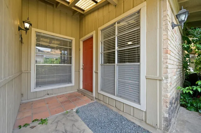 a kitchen with stainless steel appliances granite countertop a stove top oven a sink dishwasher and cabinets with wooden floor