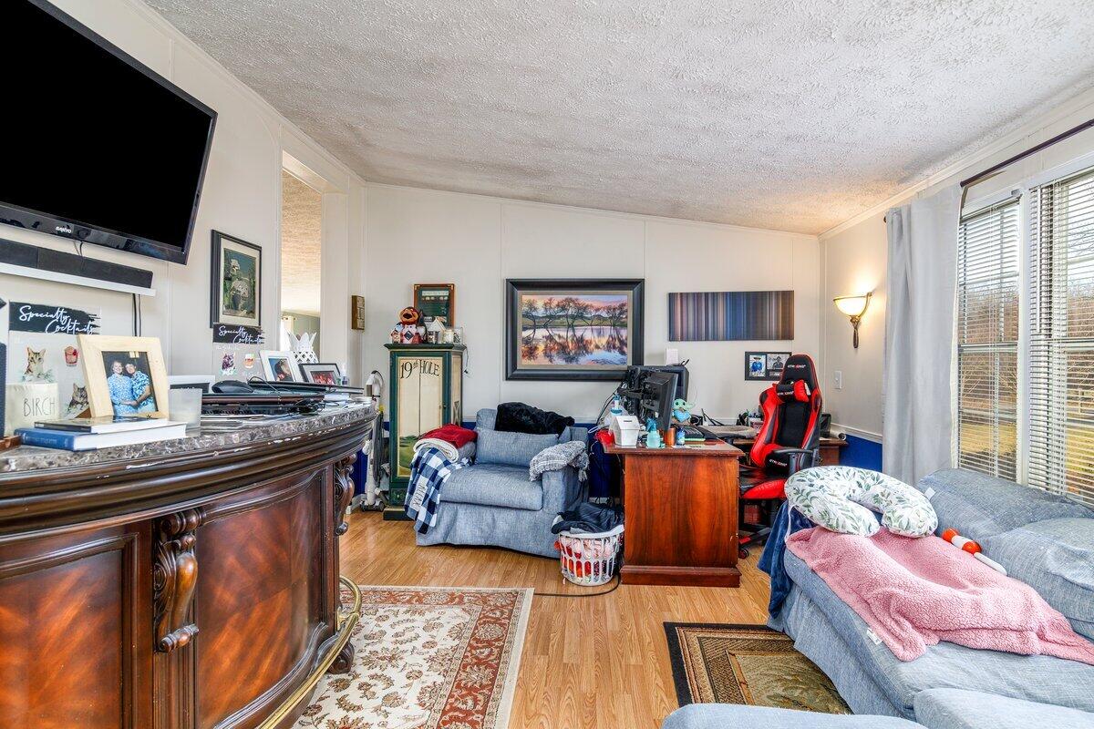 965 Callaway Road Rocky Mount, VA 24151 - Photo 6 of 41 a living room with furniture and a flat screen tv