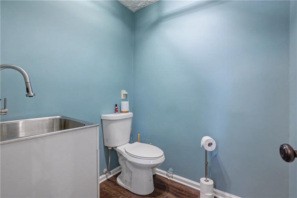 408 Candy Lane Canton, GA 30115 - Photo 19 of 22 a bathroom with a toilet and a sink