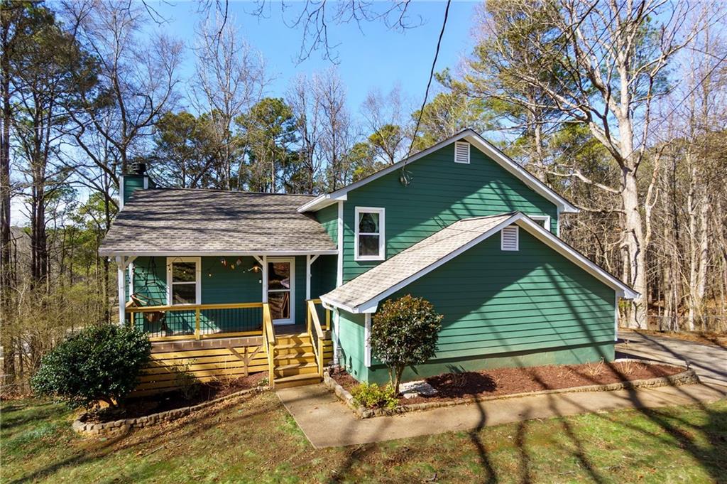 408 Candy Lane Canton, GA 30115 - Photo 2 of 22 a front view of a house with garden
