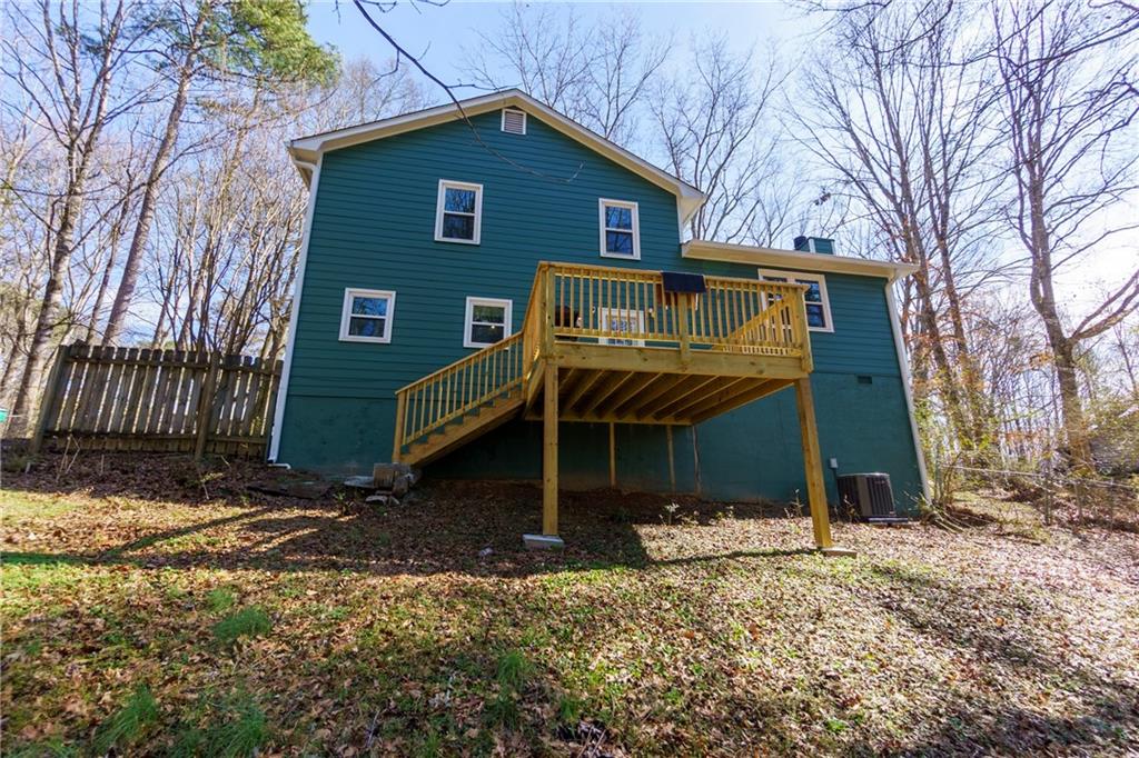 408 Candy Lane Canton, GA 30115 - Photo 21 of 22 a front view of a house with a yard