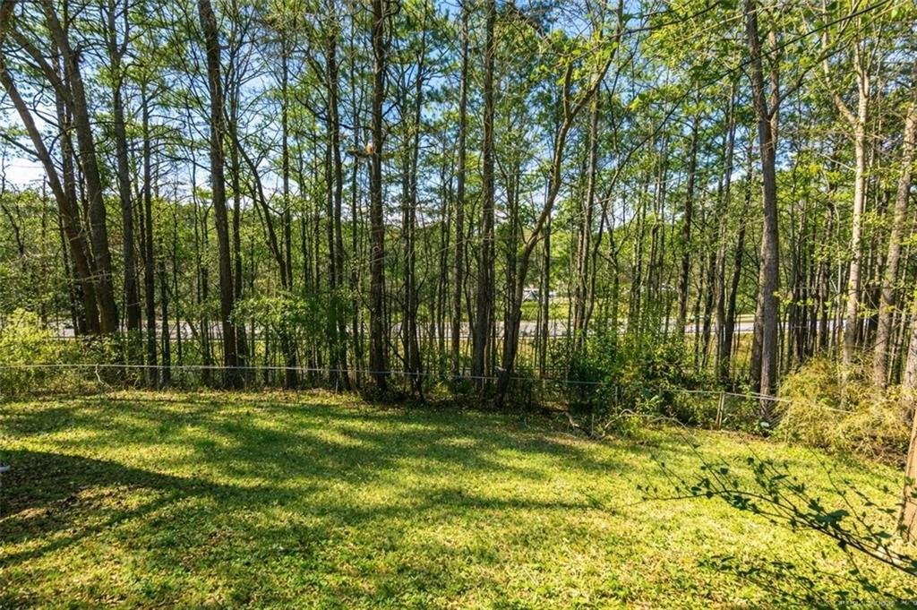408 Candy Lane Canton, GA 30115 - Photo 22 of 22 a view of outdoor space with deck and yard