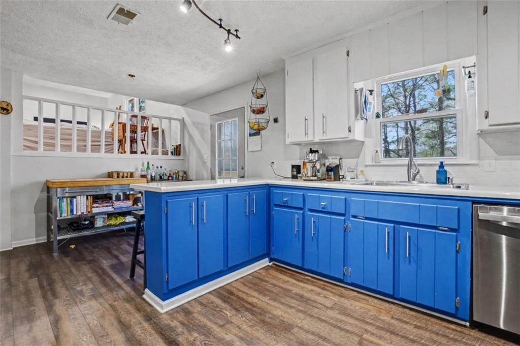 408 Candy Lane Canton, GA 30115 - Photo 9 of 22 a kitchen with a refrigerator and wooden cabinets