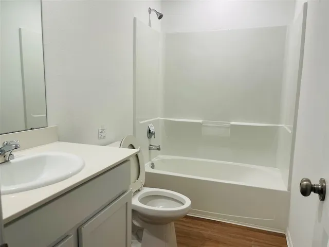 a bathroom with a sink a toilet and a bathtub