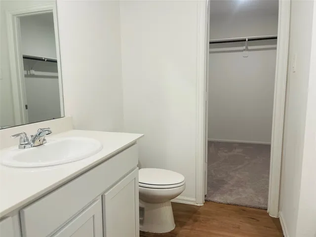 a bathroom with a sink a toilet and a shower