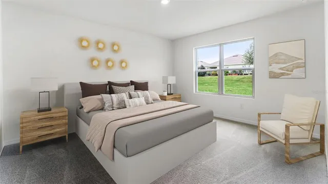 a bedroom with a bed and a chair