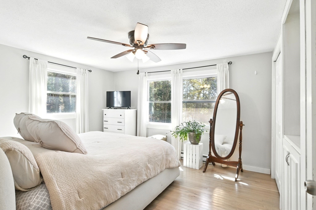 24 Old Main Road Worthington, MA 01098 - Photo 30 of 42 a bedroom with a bed and a large window