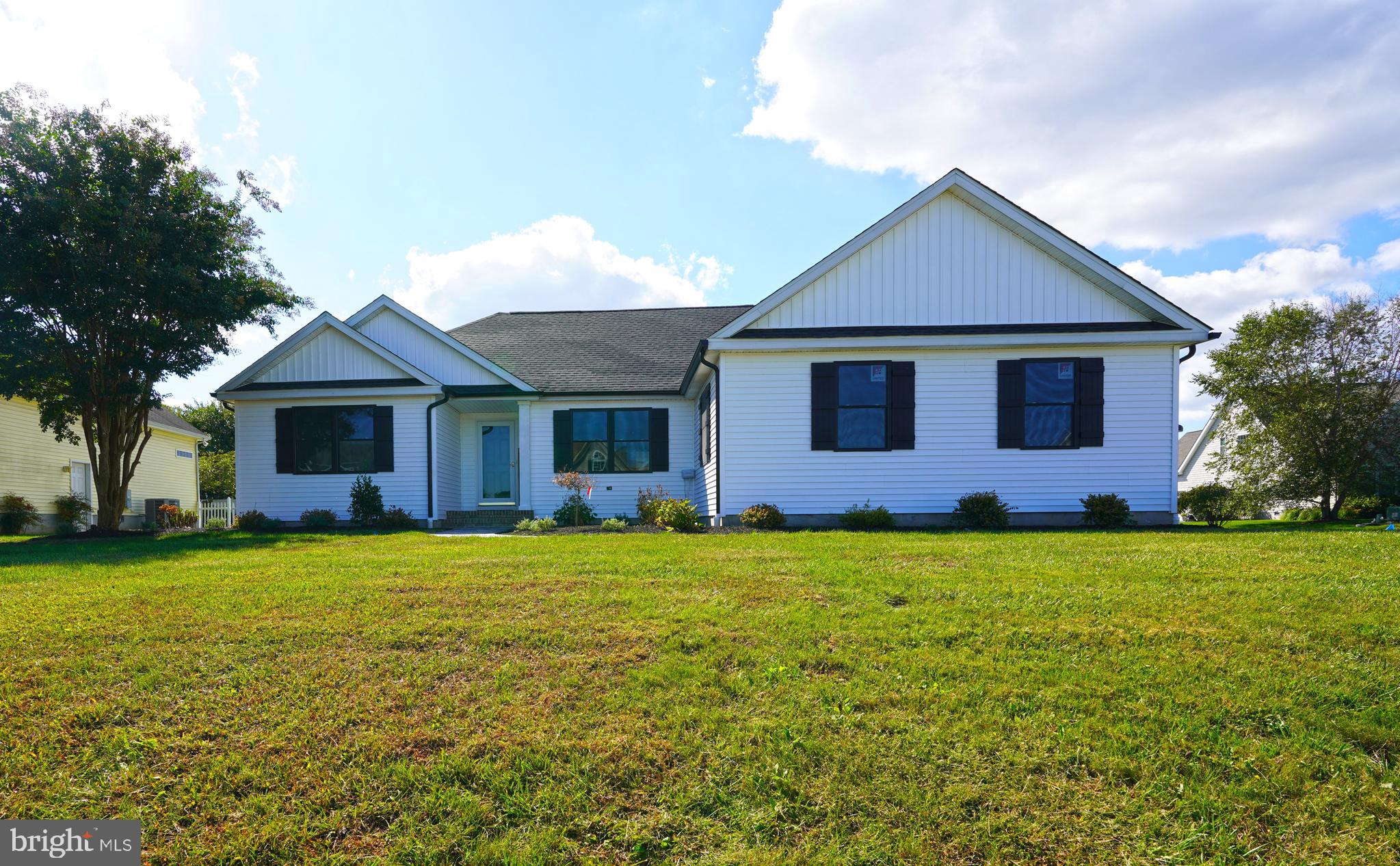 32911 Nassau Loop Lewes, DE 19958 - Photo 2 of 56 a front view of a house with garden