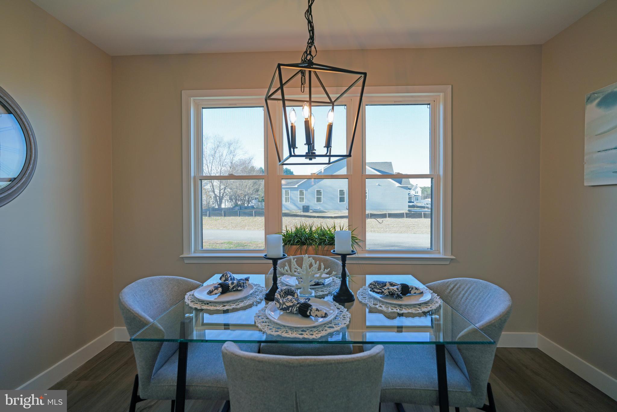 32911 Nassau Loop Lewes, DE 19958 - Photo 24 of 56 a dining room with furniture and window