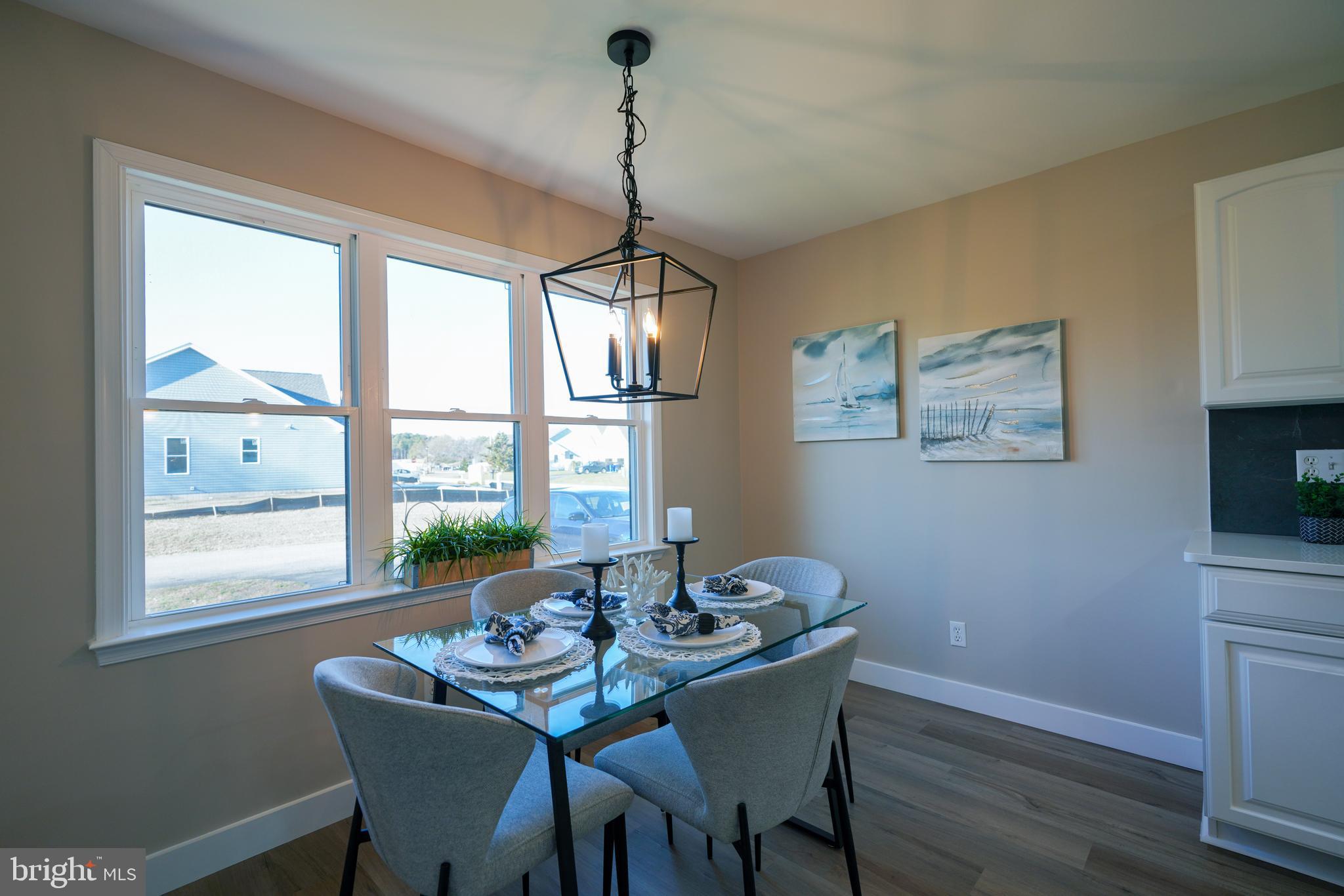 32911 Nassau Loop Lewes, DE 19958 - Photo 25 of 56 a dining room with furniture and window
