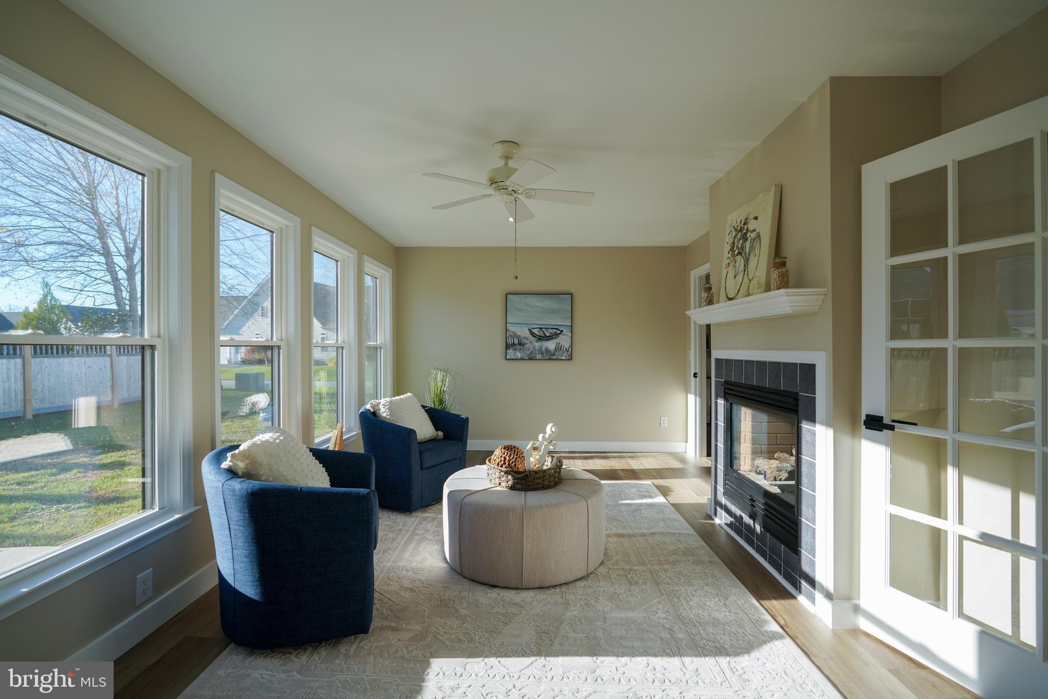32911 Nassau Loop Lewes, DE 19958 - Photo 31 of 56 a living room with furniture and a fireplace